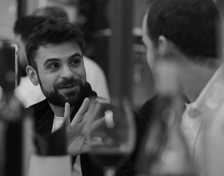 Two colleagues discussing their work